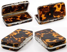 four pieces of tortoiseshell jewelry sitting next to each other on a white surface