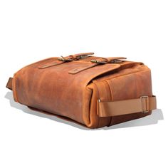 "MegaGear Torres Pro Leather Vintage 16\" Laptop Bag Camera Bag - Briefcase Satchel Portfolio Notebook Tablet Messenger Bag for Men & Women, Business *HIGHEST QUALITY ITALIAN LEATHER BAG - Made from durable, high-quality Italian tan leather, this messenger bag combines handmade aesthetics with the hallmarks of European tannery. Its full-grain leather belts, which secure the front flap to two tuck-clasp buckles, not only add to the beauty but also to the safety of this satchel bag for men / s Classic Rectangular Travel Bag With Waxed Finish, Functional Brown Satchel For Everyday Carry, Brown Functional Satchel For Everyday Carry, Rectangular Everyday Backpack, Everyday Carry Large Capacity Rectangular Satchel, Functional Brown Bags For Everyday Carry, Functional Brown Everyday Carry Bag, Large Capacity Satchel Shoulder Bag For Everyday Use, Large Capacity Everyday Satchel Bag