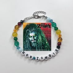 a bracelet with beads and an image of the character from the movie rob zombie on it