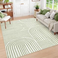 a living room filled with furniture and a green rug