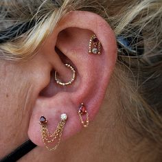 a close up of a person with ear piercings on their left and right ears