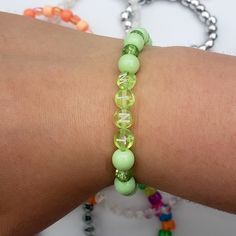 Add a refreshing touch to any look with this lovely green accessory Stretchy letter bracelet with minty crystal & plastic bubble beads Bubble Beads, Green Accessories, Kandi Bracelets, Letter Bracelet, Infinity Bracelet, Bubbles, Mint, Bracelet, Beads