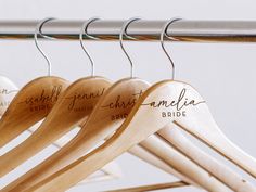 wooden clothes hangers with names on them