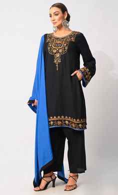 Indulge in the epitome of ethnic elegance with our exquisite 3-piece Salwar Kameez set. Intricately crafted, the Kameez boasts machine embroidery, handwork motifs, and delicate moti and CD embellishments adorning the front placket, exuding opulence and sophistication. Enhancing its allure, the Kurta features side pockets for modern convenience and intricate handwork detailing on the hem for added charm. Accompanied by a Piping matching dupatta, this ensemble effortlessly blends tradition with contemporary style, making it perfect for a myriad of occasions, from festive celebrations to formal gatherings. Elevate your wardrobe with this timeless ensemble that celebrates the artistry of Indian craftsmanship. Size & FitModel height is 5’9’ and is wearing a Small sizeMaterial & CareMaterial: Ra Eid Palazzo Set With Embroidered Border, Traditional Palazzo Set With Embroidered Border, Traditional Fitted Lawn Suit For Eid, Black Georgette Lawn Suit For Festivals, Unstitched Palazzo Set With Embroidered Border For Eid, Black Traditional Georgette Lawn Suit, Traditional Black Georgette Lawn Suit, Traditional Long Sleeve Palazzo Set With Embroidered Border, Black Churidar With Embroidered Border And Straight Kurta