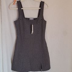 The Is A Dress From Urban Outfitters. It Is A Size Medium. It's Dark Gray With Small White Daisies On It. This Item Is Nwt. It Measures 17 Inches From Armpit To Armpit And 32 Inches From Shoulder To Hem Fitted Lined Sundress For Date Night, Fitted Cotton Sundress For Date Night, Fitted A-line Lined Sundress, Fitted Mini Dress From Urban Outfitters, Fitted Mini Dress By Urban Outfitters, Fitted Urban Outfitters Mini Dress, Sleeveless Mini Dress For Date Night By Urban Outfitters, Lined Fitted Mini Dress Casual Style, Casual Fitted Mini Dress With Lining