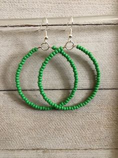 Hoop earrings are simple and lightweight. Seed beaded hoop earrings are 2 inches, handmade earrings will pair perfectly as a formal or casual accessory. Seed Bead Earrings * Perfect best friend gift!  * 2 inch earrings Earrings are READY TO SHIP TODAY!  ADD A BOX https://www.etsy.com/listing/1829605195/ MY ENTIRE COLLECTION https://www.etsy.com/shop/MiksJewelryShop   Thank you for supporting handmade and for visiting my corner of the internet. Please message me with any questions. Don't forget t Green Hoop Beaded Earrings, Green Hoop Earrings With Dangling Beads For Gift, Green Hoop Beaded Earrings With Ear Wire, Green Beaded Hoop Earrings With Ear Wire, Green Bohemian Beaded Hoop Earrings, Green Bohemian Earrings For Everyday, Green Bohemian Circle Earrings, Bohemian Green Circular Earrings, Green Hoop Beaded Earrings With Dangling Beads