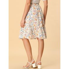 Made of floral-printed fabric, this midi skirt is high-waisted featuring an A-line silhouette. This flowy midi skirt with a tiered design and vintage allover floral prints. Featuring an A-line and tiered details, it is a summer casual skirt to be paired well with a top and sandals for a cute day look and with a stylish T-shirt and vintage high heels for a charming inspired look. Casual Floral Print Midi Skirt, Casual Midi Skirt With Floral Print, Floral Print Relaxed Midi Skirt, Flowy Floral Print Maxi Skirt, White Floral Print Flared Skirt, White Flared Skirt With Floral Print, Casual Ditsy Floral Print Skirt, Spring Floral Print Knee-length Skirt, Floral Print Flared Skirt