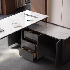 an office desk with drawers underneath it