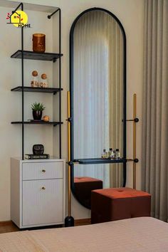 a bedroom with a large mirror and shelves on the wall