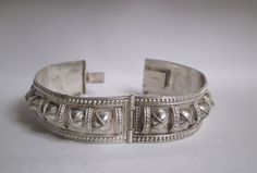 "Up for sale is this Yemeni inspired collectible, very fine, handmade, filigree sterling silver bangle bracelet. This is 3/4\" wide and 6 1/2 \" inner diameter, weighing 20.3 grams. It will fit up to 7\" wrist. It features 16 small domes in the center with wire work border, pull clasp with safety latch. It is marked 830S which is from Denmark. Condition In good vintage condition. Shows some dents dings, metal discoloration, aging patina, darkening seen which comes with use and age. The clasp is Vintage Etched Sterling Silver Bangle, Vintage Sterling Silver Hinged Bracelets, Vintage Silver Hallmarked Cuff Bracelet, Vintage Silver Hinged Bangle, Vintage Hallmarked Sterling Silver Bangle, Herringbone Necklace, Silver Bangle Bracelet, Sterling Silver Bangle Bracelets, Vintage Italy