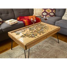 a coffee table with puzzle pieces on it