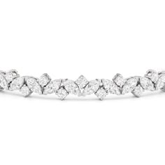 An absolute showstopper, this diamond tennis bracelet will have all eyes on your wrist. It features marquise diamonds and round diamonds arranged in a fanciful pattern to create a row of diamonds with gently undulating arches. This tennis bracelet is lovely on its own, but lovelier when worn with bangles and dainty chains. Round Diamond Tennis Bracelet, Marquise Diamond Bracelet, Luxury Marquise Tennis Bracelet For Wedding, Elegant Marquise Diamond Tennis Bracelet, Luxury Diamond Bracelet Marquise Cut, Luxury Marquise Diamond Tennis Bracelet, Luxury Marquise Cut Diamond Bracelet, Infinity Pendant, Expensive Jewelry Luxury