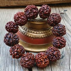 📿This Bracelet is handcrafted with Nepali 5 Mukhi Rudraksha Beads. The 5 Mukhi Rudraksha (Five Faced Rudraksha ) is one of the most popular forms of rudraksha that symbolises prosperity and success in life. It is known for releasing the person from all kinds of unwanted bonds in life and fulfils the desires of the wearer over time. This rudraksha balanced all the chakra points. This five Mukhi Rudraksha is known as the most powerful rudraksha among all rudraksha. This Rudraksha is also known as Handmade Brown Beaded Bracelets For Ceremonial Use, Handmade Brown Beaded Bracelets For Rituals, Handmade Adjustable Bangle For Puja, Traditional Handmade Beaded Bracelets For Meditation, Adjustable Traditional Bracelets For Rituals, Bohemian Beaded Bracelets For Puja, Traditional Brown Beaded Bracelets For Rituals, Handmade Mala For Rituals And Festivals, Handmade Mala For Rituals