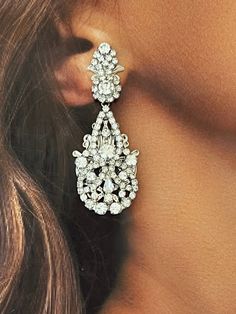 Our luxurious and glamourous DILARA earrings are perfect for any occasion. It's silhouette is created with light-catching crystals to reflect its beauty. They will create a polished look with little effort for a high-style special event. Handcrafted Highest Quality Swarovski / Cubic Zirconia Platinum plated Guards against scratches and tarnish. approximate size 2.06" length 1" width Nickel free Free shipping in USA Teardrop Bridal Earrings, Earrings For Bride, Artistic Earrings, Bridal Earrings Chandelier, Crystals Earrings, Crystal Bridal Tiaras, Bridal Necklace Set, Luxury Earrings, Gold Statement Earrings