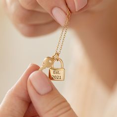 Show that special someone just how much you love them with our Personalised Love Locket and Key pendant. This beautiful handmade necklace, available in sterling silver or gold plate, includes a pretty locket-shaped pendant that we can personalise on both sides and a tiny detailed key. You could add your initials with a heart, as shown in the image, a meaningful date such as the day you first met or your wedding anniversary, or a short message of love. Presented on a trace chain, our Personalised Love Locket and key will appeal to those who adore timeless, elegant jewellery. Wear it solo or stacked with other bespoke necklaces to showcase your unique sense of style. DIMENSIONS Chain 16-18″ or 18-20″ Padlock: Approx 10mm x 15mm, Thickness 2.5mm MATERIAL Sterling Silver Sterling Silver plated Friendship Necklaces Lock And Key, Gold Sterling Silver Locket Necklace For Anniversary, Yellow Gold Locket Necklace With Charms For Gift, Mother's Day Anniversary Locket Necklace With Charms, Hallmarked Locket Necklace As Valentine's Day Gift, Hallmarked Locket Necklace For Valentine's Day Gift, Personalized Pendant Locket Necklace For Anniversary, Personalized Sterling Silver Locket Necklace, Gift For Her, Charm Pendant Jewelry For Anniversary Gift