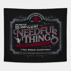 the label for nedful things, which is printed on black paper with red and white lettering