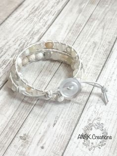 This Leather wrap diffuser bracelet has all the white and clear gemstones and crystals. It'll go with any outfit all year round!  A great gift for both women and men. Plus, It's adjustable and fits small, medium or large.  CRYSTALS USED  White Quartz, Howlite, Cherry Quartz, Soapstone, Agate, River Shell, Moonstone, Tourmalinated Quartz, Lava Stone, and Morganite  SIZE  Bracelet is 16in long and is adjustable to fit a medium and a large. WHAT IS AN ESSENTIAL OIL BRACELET  bracelets that allows you to diffuse essential oils. These bracelets have lava beads or wood beads throughout each bracelet that you put the essential oils of your choice on them. (Just on the lava or wooden bead) and you reapply those oils as needed during the day. PROCESSING & SHIPPING TIME This item is ready to ship. I Clear Gemstones, Oil Bracelet, Birthday Best Friend, Best Friend Bracelet, Friend Bracelet, Essential Oil Bracelet, Cherry Quartz, Tourmalinated Quartz, Friend Bracelets