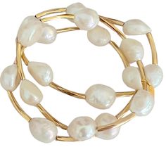 Elevate your elegance with our stunning Adina Pearl Bracelet Set, designed to make an elegant statement. Each Bracelet features 15mm lustrous Freshwater Pearls, adorned with gold-filled bars that exude timeless beauty and sophistication. 15mm freshwater pearls gold filled bars non-tarnish Elegant Gold Bracelet With Baroque Pearl, Elegant Formal Baroque Pearl Bracelets, Elegant Baroque Pearl Bracelet, Gold Pearl Oyster Bracelet For Formal Occasions, Gold Oyster Pearl Bracelet For Formal Occasions, Elegant Baroque Pearl Beaded Bracelets In Pearl White, Formal Gold Pearl Bracelet With Oyster Design, Elegant Gold Baroque Pearl Bracelet, Luxury Baroque Pearl Bracelet For Formal Occasions