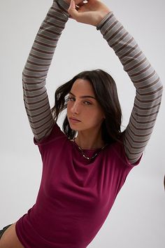 '90s-inspired BDG long-sleeve tee in a slim & cropped fit. Featuring a boatneck & cap sleeve tee with a contrasting long-sleeve for an effortless layered look. Only at Urban Outfitters. Features BDG Sloane layered twofer tee Layered long sleeve tee Soft and stretchy knit Wide boatneck and cap sleeves with a layered contrasting long-sleeve Slim body-skimming fit Cropped length Easy pull-over style Only at Urban Outfitters. Contents + Care 100% Cotton Machine wash Imported Size + Fit Model in Grey Long Sleeve With Short Sleeve Over It, Layered T Shirts Long Sleeve, Tank Top Over Long Sleeve, Long Sleeve And T Shirt Layering, Long Sleeve Under Shirt, Urban Outfitters Clothes, Cap Sleeve Tee, Layered Long Sleeve, Cold Outfits