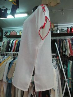 "Beautiful deadstock 60s blouse. Vintage romanian/hungarian white blouse. White coloured with typical red and brown hand embroideries (pics 2-3-7). Raglan sleeves. Drawstring scoop neckline (pic.2). Short sleeves. No label for fabric, but it's typical material for such kind of blouses, maybe homespun cotton. Boho/hippy style. Vintage ethnic blouse. Mint conditions. It can fit size S- M-L depending on desired fit Measurements: (lay flat and double chest) Shoulders: up to 17.7\" chest 48\" sleeve Summer Cotton Kurta With Embroidered Sleeves, Bohemian Summer Kurta With Embroidered Sleeves, Summer Bohemian Kurta With Embroidered Sleeves, Traditional V-neck Spring Blouse, Summer Folk Peasant Top With Embroidered Sleeves, Fitted Peasant Blouse With V-neck, Fitted V-neck Peasant Blouse, Summer Tunic Top With Embroidered Sleeves, Traditional V-neck Festival Blouse