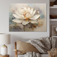 a large white flower sitting on top of a couch