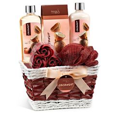 a basket filled with body care products on top of a white table next to a red rose