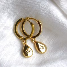 Classy and timeless these gold hoop earrings are perfect for everyday. Gold huggie hoops adorned with dainty gold drops, these will be your new favorite earrings and they make a perfect gift for her!  D E T A I L S These everyday earrings are high quality 18kt Gold Filled huggie hoops, 15mm. Adorned with a gold plated 16mm drop S H O P ∙ O U R ∙ D E S I G N S https://www.etsy.com/shop/thesilverwren ∙ EXTRA LOVE ∙ Handcrafted just for you in sunny Arizona by a team of talented women. All of our j Gold Plated Teardrop Huggie Earrings For Gift, Dainty Gold Huggie Earrings For Gift, Teardrop Gold Plated Huggie Earrings For Gift, Gold Teardrop Hoop Earrings For Anniversary, 14k Gold Filled Teardrop Hoop Earrings For Anniversary, Teardrop 14k Gold Filled Hoop Earrings For Anniversary, Gold Huggie Earrings With Dangling Charms For Everyday, Gold Teardrop Huggie Earrings For Everyday, Teardrop Tarnish Resistant Huggie Earrings For Anniversary