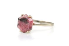 Decorated with unique hues of Rhodonite stone, this elegant piece is awesome to style with other minimalist fashion rings. Also an excellent piece to choose as an unique engagement ring, promise ring, or just something to add to your collection. ☛ 𝒜𝐵𝒞 - Add Engraving - https://etsy.me/3CLxYPZ ☛ Ring size - Select the size you would like from the drop down menu ♥ Gemstone Type - Rhodonite ♥ Gemstone Size - 10mm ♥ Gemstone Cut - Hexagon ♥ Metal Type (Main Photo) - 925 Sterling Silver - Other op Pink Stone Engagement Rings, Rhodonite Ring, Engagement Ring Pink, Rhodonite Crystal, Wardrobe Space, Pink Rhodonite, Simple Rings, Pink Engagement Ring, Gold Gemstone Ring