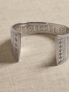 Crafted by hand, this rounded cuff style displays the expert hand of its Tuareg makers: a hand-hammered shape, intricate filling, and ornamental engravings that are equal parts ornament and talisman.  ETHNOPUR: Ethnopur works with and supports artis Arabic Jewelry Traditional Silver, Inspiration Bracelets, Bolo Tie, Women's Jewelry And Accessories, The Expert, Rings Necklaces, Jewelry For Women, Jewelry And Accessories, Women's Jewelry