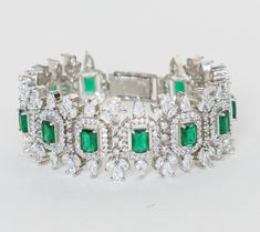 Featuring a white finish faux diamond bracelet with green stones. It is perfect for a cocktail party and can be paired with an indo western style for a cocktail. Dimensions (Inches) : 6 x 1 Composition : Faux Diamonds, Green Stones & Mixed Metal Care: Keep away from water and perfume Delivery : 6-8 weeks as the product is hand crafted. For more information and sizes please contact fabiliciousfashion@gmail.com or visit our Copenhagen studio. About the Designer : For brides-to-be and jewellery lov Formal Green Bracelets With Diamond Accents, Green Bracelets With Diamond Accents For Formal Occasions, Green Rhinestone Bracelets For Wedding, Indian Theme, Indian Wedding Wear, Green Stones, Indo Western, Traditional Indian, Mixed Metals