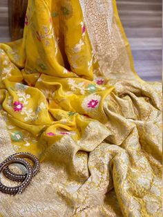 Update! - Zynah covered by LBB - https://lbb.in/bangalore/zynah-designs-handloom-sarees/ Banarasi pure georgette woven saree, decorated with intricate design. Their special characteristics are Mughal inspired designs such as intricate interwining floral and foliate motifs. Other features are gold/Silver work, compact weaving, figures with small details, metallic visual effects, pallus, jal (a net like pattern). Depending on the intricacy of its designs and patterns, a saree can take from 15 days Benares Georgette Sarees, Yellow Art Silk Anarkali Set With Chikankari Embroidery, Semi-stitched Bollywood Blouse Piece In Jamawar, Semi-stitched Banarasi Silk Blouse Piece With Pallu, Semi-stitched Banarasi Silk Blouse With Chikankari Embroidery, Yellow Art Silk Sharara With Chikankari Embroidery, Yellow Sharara With Chikankari Embroidery In Art Silk, Yellow Chikankari Embroidery Sharara In Art Silk, Bollywood Banarasi Silk Saree With Chikankari Embroidery