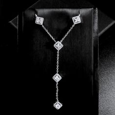 Modern and eye-catching, this lariat style necklace can complete the most sophisticated of bridal looks. All it takes is a simple glance at this delicate design to see its extremely subtle and classy look that makes a glamorous and feminine statement. Adorned with high grade cubic zirconia that capture the light in a dazzling array of sparkles, the necklace is rhodium plated for a smooth finish which enhances the intricate detailing and conveys a modern take on old elegance. Length of the neckla Bridal Accessories Belt, Hair Accessories Tiara, Lariat Style Necklace, Flower Girl Jewelry, Pearl Bridal Jewelry, Pearl Jewelry Sets, Long Drop Earrings, Bridal Belt, Bridal Hair Pins