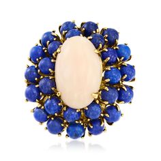 Ross-Simons - C. 1960 Vintage Pink Coral, Lapis Cocktail Ring in 14kt Yellow Gold. Size 7. C. 1960. This modern marvel comes from our Estate collection with a unique contrast of soft and bold colors. A blushing 20x12mm oval pink coral cabochon is surrounded by a double halo of 5mm round lapis beads, set on a band of glossy 14kt yellow gold. Natural pyrite flecks in lapis will vary. 1 3/8" wide. Lapis and pink coral ring. Exclusive, one-of-a-kind Estate Jewelry. Jewelry Presentation, Antique Jewelry Rings, Coral Ring, Coral Stone, Lapis Lazuli Stone, Double Halo, Pink Coral, Pink Stone, Cocktail Ring