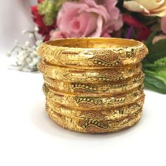 Handmade Indian Bridal Jewellery 22ct Micro Gold Plated 6 Bangles  Pakistani Indian Gold Plated Jewelry Set Of 6 PLEASE NOTE, This Item Is Not Real Gold .Only Good Quality Gold Plated Jewellery .This is Artificial Jewellery.  Traditional Indian Wedding Jewellery Slight Colour variations possible due to difference in screen and photograph  It is a perfect match with formal attire on special occasions or with casual wearing Care instructions Keep Jewellery away from direct heat, water, perfumes, d Traditional Yellow Bracelets For Diwali, Traditional Yellow Bracelets For Festive Season, Traditional Yellow Gold Bracelet For Wedding, Heavy Gold Bangle For Diwali, Heavy Gold Bollywood Bangle, Gold Meenakari Bangle For Puja, Heavy Bollywood Gold Bangle, Heavy Gold Bangle For Puja, Gold Bollywood Bracelets For Ceremonial Occasions