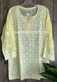 Chikankari hand embroidered kurti top on georgette.  Intricate hand embroidery with 'Mukaish' add ons.  Length: 30 inches Sleeves: 3/4 th Liner included Chanderi Resham Embroidery Straight Kurta Top, Straight Kurta Top With Resham Embroidery In Chanderi, Georgette Tops With Chikankari Embroidery For Wedding, Wedding Tops With Chikankari Embroidery On Georgette, Festive Georgette Top With Intricate Embroidery, Embroidered Straight Kurta Top In Chanderi, Embroidered Chanderi Straight Kurta Top, Designer Chikankari Embroidery Blouse For Eid, Traditional Georgette Tops With Zari Work