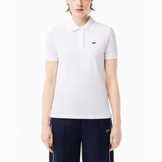 The ribbed finishes and mother-of-pearl buttons make this soft petit piqué polo shirt a perfect option to always look elegant. 
It has a straight cut. If you have any questions about the product, we recommend that you contact us. We will be happy to help you. Polo Lacoste, Lacoste Polo Shirts, Lacoste Women, Lacoste Sport, Polo Classic, Lacoste Polo, Pique Polo Shirt, Polo Shirt Women, Golf Polo Shirts