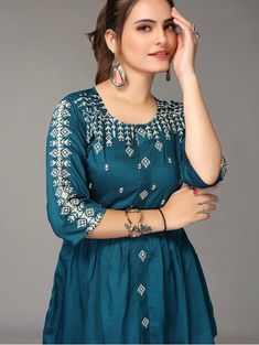 HAND CRAFTED TUNIC DESCRIPTION * Teal regular cinched waist top * Flora Embroidered * Round neck, three-quarter, regular sleeves * Embroidered detail * Woven *Fabric:- Rayon *Package Contains:- Only one kurti *Wash Care:- Hand Wash AVAILABLE IN 7 SIZES THEY ARE IN FOLLOWING MEASUREMENTS IN INCHES:- XXS:- Bust-32/Waist-24/Length-30 XS:- Bust-34/Waist-26/Length-30 S:- Bust-36/Waist-28/Length-30 M:- Bust-38/Waist-30/Length-30 L:- Bust-40/Waist-32/Length-30 XL:- Bust-42/Waist-34/Length-30 XXL:- Bust Indowestern Kurti, Kurti Short, Western Kurti, Western Kurtis, Kurti Top, Indian Tops, A Line Kurti, Indian Tunic, Short Kurta