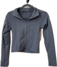 Gray Fitted Activewear For Fall, Fitted Gray Activewear For Fall, Gray Fall Activewear Sportswear, Gray Fall Sportswear Activewear, Casual Gray Outerwear For Workout, Casual Stretch Track Jacket With Thumbholes, Stretch Sportswear Outerwear For Yoga, Functional Fitted Yoga Outerwear, Casual High Stretch Track Jacket For Fall