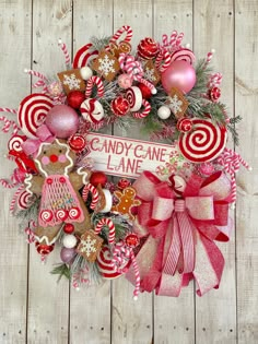 a candy cane wreath on a wooden background