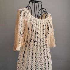 Introducing our stunning crochet lace cream beige women's summer party beach romantic dress.  The delicate crochet lace design adds a touch of vintage charm, while the creamy beige hue exudes a timeless beauty.  Perfect for summer soirées and beachside wanderings, this dress is bound to turn heads wherever you go. With its feminine silhouette and dreamy aesthetic, it is a must-have addition to your summer wardrobe. Embrace your inner romantic and feel effortlessly beautiful in our crochet lace c Crochet Lace Beach Dress, Elegant Crochet Top For Beach, Elegant Crochet Trim Top For Beach, Bohemian Cream Crochet Dress With Crochet Trim, Bohemian Cream Crochet Top For Summer, Summer Lace Crochet Dress With Crochet Trim, Summer Crochet Lace Dress With Crochet Trim, Elegant Crochet Lace Dress For The Beach, Elegant Crochet Lace Top For Summer