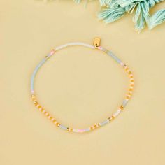 Pretty pastels with a story to tell this summer. The mixed seed bead Pineapple Crush Stretch Anklet features a patterned design of four summery shades with gold spacer seeds placed in between. String on durable nylon cord that adjusts and stretches to any size Length of anklet is 9" Because jewelry products are handcrafted by artisans, dimensions may vary from piece to piece Gold Bohemian Beaded Bracelets For Spring, Spring Beach Bracelets With Tiny Beads, Adjustable Colorful Beads Friendship Bracelets For Spring, Summer Gold Beads Bracelets For Beach, Summer Yellow Beaded Bracelets With Tiny Beads, Casual Beaded Bracelet With Gold Beads For Beach, Summer Gold Friendship Bracelets With Colorful Beads, Summer Gold Beaded Bracelets, Spring Multicolor Tiny Beads Friendship Bracelets