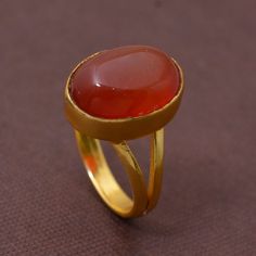 Handmade PRODUCT CODE :- HA1 Material :- Brass Size :- Any Carnelian Brass Ring,Handmade Ring,Unique Ring,orange Stone Ring,Boho Ring,Anniversary Ring,Wedding Ring,Vintage Ring,Gift Ring, Deco Ring, This Red carnelian gold ring have a statement Anyone will notice your classic style with that amazing unique ring, Carnelian stone is known for encouraging motivation, prosparity and good luck.:) ♥We Crafted These in 100% Solid Brass These Simple rings are perfect for any occasion. Make a Statement w Oval Natural Stone Rings For Anniversary, Oval Rings With Natural Stones For Anniversary, Oval Natural Stones Anniversary Rings, Oval Cabochon Birthstone Ring Gift, Oval Natural Stones Promise Ring, Oval Natural Stone Promise Ring, Chic Oval Natural Stone Promise Ring, Classic Chalcedony Rings As Gift, Oval Natural Stone Rings For Weddings