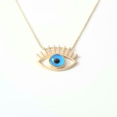 - Eye Evil Eyelash Pendant Necklace is made with high quality 14K real solid yellow gold. - Eye Evil Eyelash Pendant Necklace for women is decoreted with blue evil eye Stone. Evil Eyes are also called Turkish Greek Evil Eye, Faith Protection and Nazar. - This cute, charm, dainty, delicate, elegant women jewelry Eye Evil Eyelash Pendant Necklace has been artfully designed for timeless yet modern millennial fashion. - You receive the necklace in a beautiful and free gift box - Free shipping (Arriv Blue Sterling Silver Jewelry For Celebration, Celebration Blue Sterling Silver Jewelry, Blue Spiritual Gold-plated Necklaces, Blue Gold-plated Jewelry For Celebration, 14k Gold Evil Eye Jewelry Gift, Blue Pendant Necklace In 14k Gold, Blue 14k Gold Pendant Necklace, Blue Gold Plated Necklaces As Gift, Spiritual Blue Gold-plated Jewelry