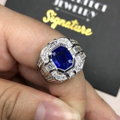 BRAND-NEW!! ONE OF A KIND, HANDCRAFTED RING. EXQUISITE AND FINE CRAFTSMANSHIP! HANDMADE TO LAST FOR AN ETERNITY!! HEIRLOOM PIECE!! PRECIOUS JEWELRY TO BE PASSED ON! PERFECT DRESS RING FOR A GENTLEMAN! 4.63 total carat weight, Certified, Natural blue sapphire ring. This ring offers an important statement of who you are with a 3.21 carats, VIVID BLUE, transparent, CEYLON BLUE SAPPHIRE. Accentuating the BLUE SAPPHIRE are the 46 F/VS, sparkling natural diamonds SUGGESTED RETAIL VALUE: $10,500   BLUE Luxury Platinum Round Cut Signet Ring, Luxury 14k White Gold Signet Ring As Gift, Luxury 14k White Gold Signet Ring, Platinum Signet Ring As Gift, Gia Certified Octagon Sapphire Luxury Ring, Gia Certified Octagon Sapphire Ring, Luxury Style, Luxury Sapphire Diamond Ring With Diamond Cut, Luxury Octagon Sapphire Ring With Brilliant Cut, Luxury Gia Certified Octagon Sapphire Ring