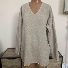 Great Condition! Size Medium It Fits Like A Women's Size 10-12 Soft Beige 100% Pure Cashmere V-Neck High Low Oversized Tunic Style 2 Lower Front Pockets Soft And Cozy Knit Retail: $358 So Luxurious!!!!! Qq-7 Oversized Cream V-neck Sweater, Cream Cashmere V-neck Sweater, Cream Oversized V-neck Sweater, Cream Soft Knit V-neck Sweater, Beige Cashmere V-neck Top, Beige V-neck Cashmere Top, V-neck Cashmere Sweater For Loungewear, Oversized Fine Knit V-neck Sweater, Beige Soft Knit V-neck Sweater