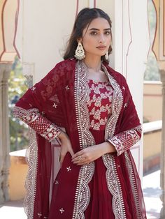 This fully stitched gown features exquisite sequin embroidered work on rich maroon jacquard fabric, making it a show-stopping piece that is sure to turn heads. Paired with a similar color georgette dupatta adorned with sequins and cutwork embroidery, this ensemble exudes elegance and sophistication.
This gown includes a flattering 12-meter flair and a gown length of 56 inches, ensuring a graceful silhouette for all sizes ranging from XS to XXL. The 2.3-meter-long dupatta adds a touch of ethereal Festive Formal Embroidered Fabric With Sequins, Festive Formal Embroidered Sequin Fabric, Festive Brocade Dress With Resham Embroidery, Festive Brocade Gown With Dupatta, Embroidered Brocade Floor-length Sets, Embroidered Floor-length Brocade Sets, Red Sequined Dress With Traditional Drape, Semi-stitched Brocade Gown With Resham Embroidery, Brocade Anarkali Dress For Reception