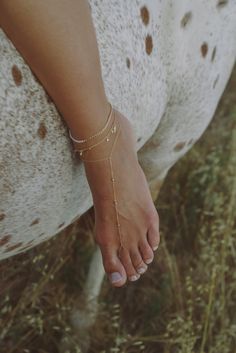 Not sure if you want a pearl anklet or chain anklet? Our Dahlia Anklet is perfect for you. Handcrafted in 14K gold-filled, Our Dahlia Anklet features a half freshwater pearl half cuban link chain anklet that is perfect to wear all year round. Style alone or stack with any of our anklets or foot chains.14K gold-filled jewelry is water resistant and hypoallergenicEach gemstone is one of a kind, please note the possibility of natural inclusionsHandmade with love in Los Angeles 14K Gold-Filled Gold- Gold Body Chain, Foot Chain, Pearl Anklet, Gold Bond, Gold Anklet, Foot Jewelry, Hand Chain, Chain Anklet, Cuban Link Chain