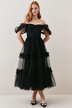 Imbued With Artisanal Allure And Dark Romance, This Captivating Tulle Dress Promises To Make An Entrance At Your Next Event. A Draped Corset Bodice Cinches The Waist, Adding A Sultry Element, While The Tiered Tulle Skirt Flares Out To Create A Dramatic Silhouette Which Exudes High-End Glamour.Tiered Tulle Skirtcorset Bodicedraped Mesh Sleeves Tiered Tulle Dress, Draped Corset, Lydia Millen, Dressing Table Ideas, Tiered Tulle Skirt, Dramatic Silhouette, Tiered Dresses, Long Formal Dress, Corset Bodice