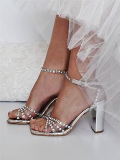 Our sandals have been made in Greece from silver leather and adorned with light-catching crystals that shimmer like a piece of jewelry. They're set on towering 100mm block stilettos. ♥ Colour: Transparent/ Silver ♥ Heel height: 10 cm (3.93 in) ♥ Sizing: Fits true to size, take your normal size ♥ If you need a rush delivery please let us know. ♥ Returns: The item(s) can be returned for refund within 10 days of the order's delivery date. In order for returns to be accepted, all items must be in perfect condition with security tag, original packaging and original invoice. In this case, you shall solely bear the immediate cost of returning the product. ♥ Please add your phone number in your order details. It will be needed for delivery courier. Thank you! We create high quality wedding dresses Sparkling Block Heel Wedding Sandals, Sparkling Summer Wedding Shoes For Prom, Gala Wedding Shoes With Rhinestones And Ankle Strap, Wedding Shoes With Rhinestones And Ankle Strap For Gala, Sparkling Heels For Summer Wedding, Summer Wedding Sparkling Heels, Ankle Strap Wedding Shoes With Rhinestones For Gala, Sparkling Summer Wedding Heels, Sparkling Open Toe Evening Wedding Shoes