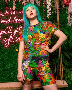 The big cat obsession continues! Our new Feline Fierce print features big cats galore.. tigers, lions, leopards, jaguars and panthers in a lush tropical jungle with pops of bright animal print.  Pair this super soft t-shirt with our Feline Fierce leggings and kimono for a fully fierce co-ord - more is more! Print designed by Dazzle & Jolt and printed and made in London.  Approx size info: S: chest 47cm x length 66cm M: chest 50cm x length 69cm L: chest 52cm x length 71cm XL: chest 54cm x length Summer Crew Neck Sublimation T-shirt With Funny Print, Multicolor Funny Print T-shirt For Streetwear, Multicolor Graffiti Print T-shirt For Summer, Summer Festival Graphic Print T-shirt, Graphic Print Festival T-shirt For Summer, Fun Multicolor Printed T-shirt, Multicolor Print Summer Streetwear Tops, Fun Short Sleeve T-shirt For Music Festival, Multicolor Print Tops For Summer Streetwear